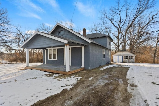 view of front of home with an outbuilding and a garage