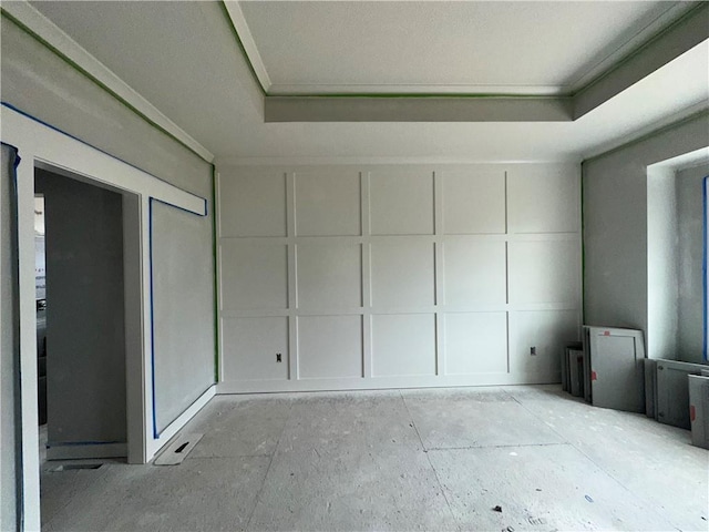 unfurnished room with a tray ceiling