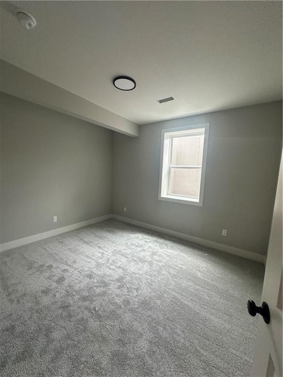 7050 NW Yulich Ct, Parkville, MO 64152 - carpeted spare room featuring baseboards