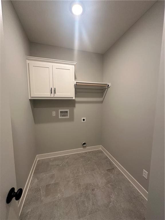 7050 NW Yulich Ct, Parkville, MO 64152 - laundry room featuring baseboards, hookup for an electric dryer, washer hookup, and cabinet space