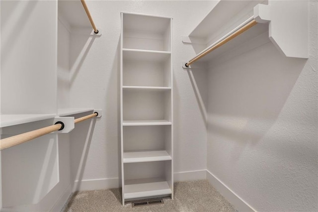 7050 NW Yulich Ct, Parkville, MO 64152 - walk in closet featuring carpet floors