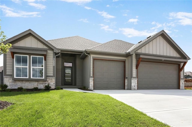 7050 NW Yulich Ct, Parkville, MO 64152 - view of front facade featuring stone siding, an attached garage, a front yard, driveway, and a shingled roof
