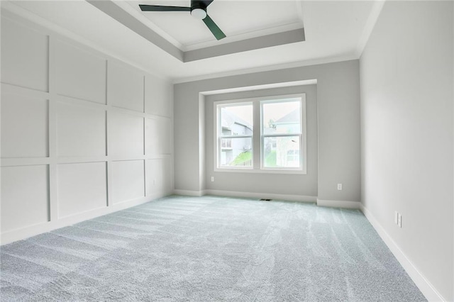7050 NW Yulich Ct, Parkville, MO 64152 - unfurnished bedroom with a raised ceiling, crown molding, light carpet, and ceiling fan
