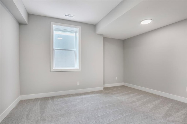 7050 NW Yulich Ct, Parkville, MO 64152 - spare room featuring light colored carpet