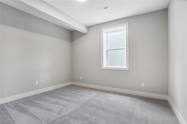 7050 NW Yulich Ct, Parkville, MO 64152 - spare room featuring carpet flooring and baseboards