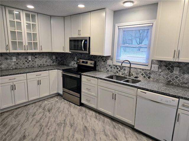 kitchen with white cabinets, sink, and stainless steel appliances