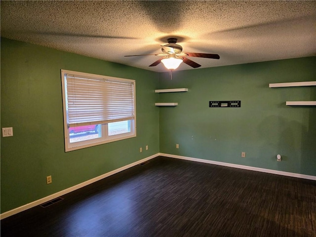 empty room featuring hardwood / wood-style flooring, ceiling fan, and a textured ceiling