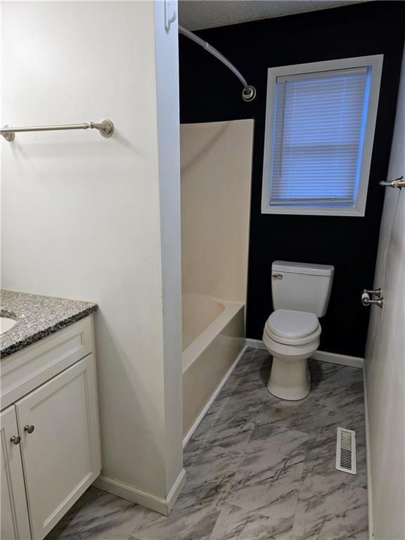 full bathroom featuring shower / bathing tub combination, vanity, and toilet