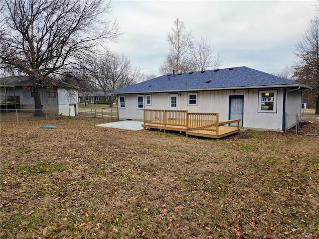 rear view of property with a patio and a wooden deck