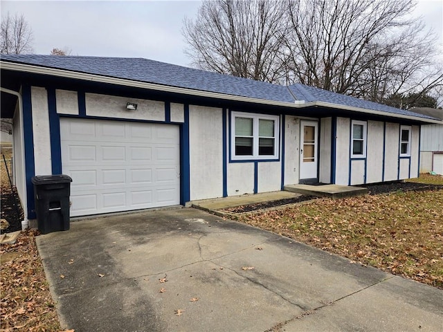 single story home featuring a garage