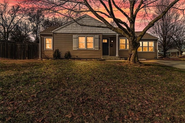 ranch-style house featuring a yard