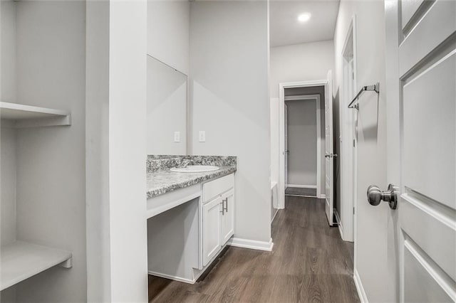 bathroom featuring vanity and hardwood / wood-style flooring