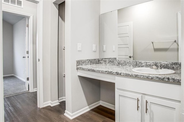 bathroom with vanity and wood-type flooring