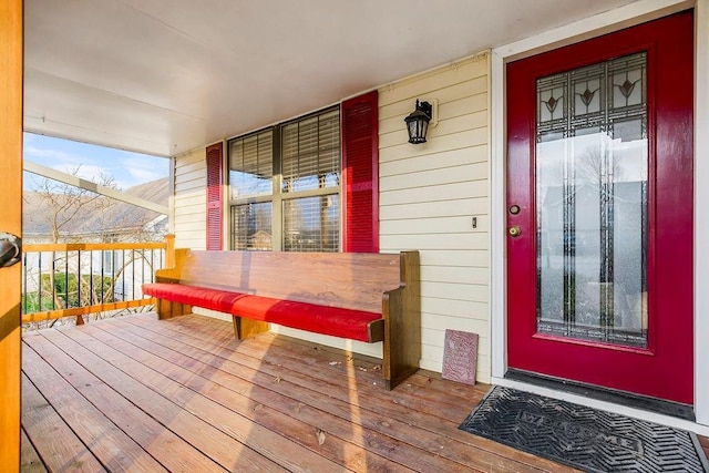 wooden terrace with a porch