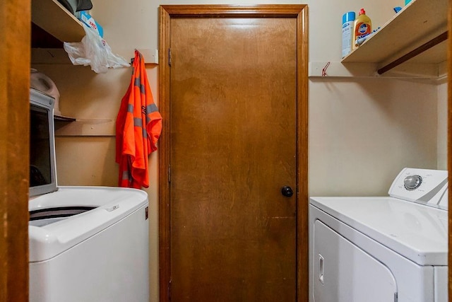 washroom featuring separate washer and dryer