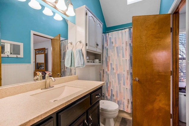 bathroom with vanity, tile patterned flooring, toilet, and walk in shower