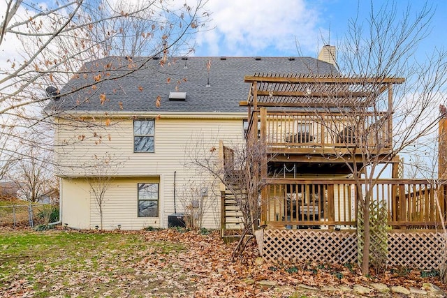 back of property featuring a wooden deck and cooling unit