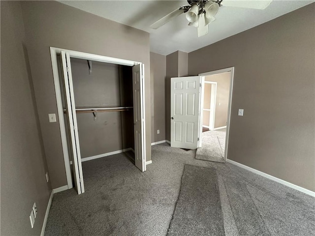 unfurnished bedroom featuring ceiling fan, a closet, and dark carpet