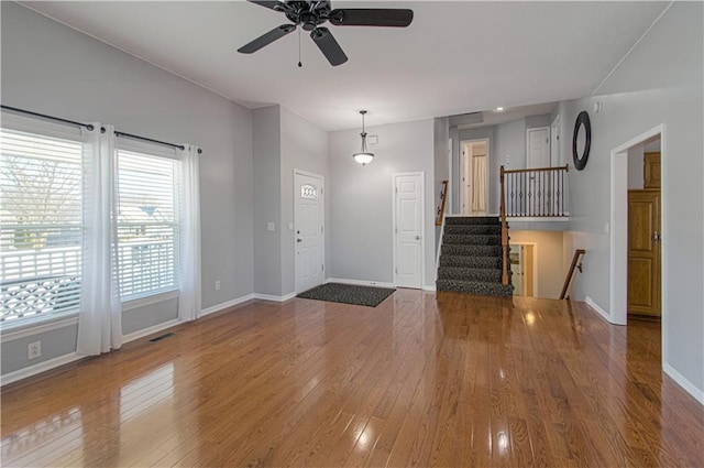 foyer with ceiling fan and hardwood / wood-style flooring