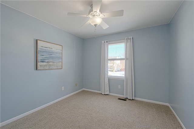 empty room featuring light carpet and ceiling fan