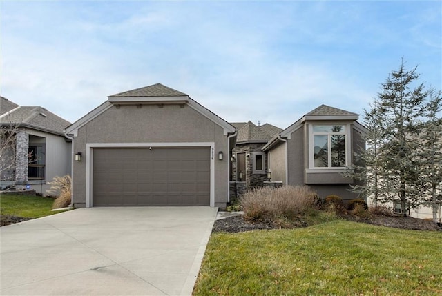 view of front facade featuring a garage and a front yard