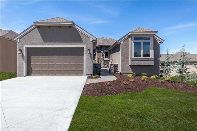 view of front facade with a garage and a front lawn