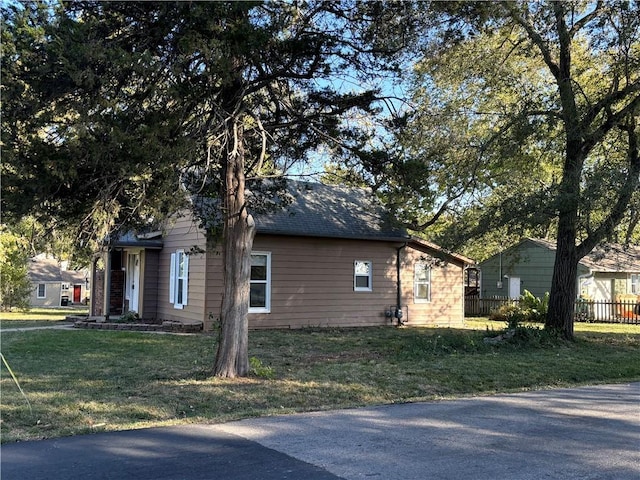 view of home's exterior with a yard