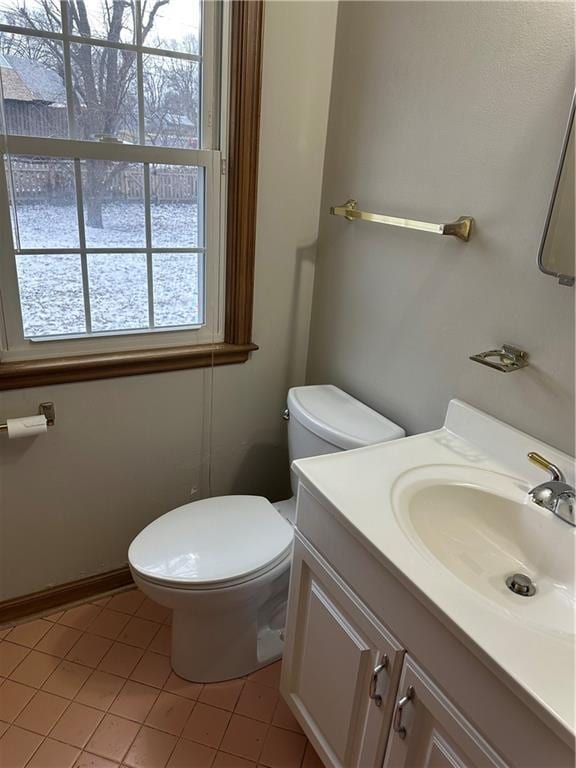 bathroom featuring vanity, toilet, and tile patterned flooring