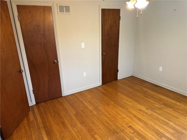 unfurnished bedroom featuring light wood-type flooring