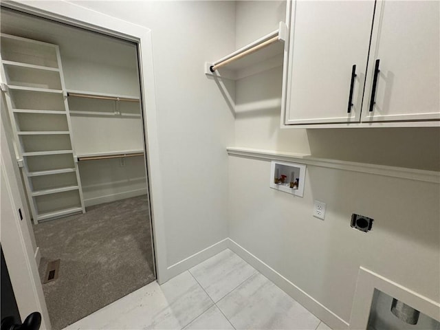 laundry area featuring washer hookup, cabinets, hookup for an electric dryer, and light colored carpet