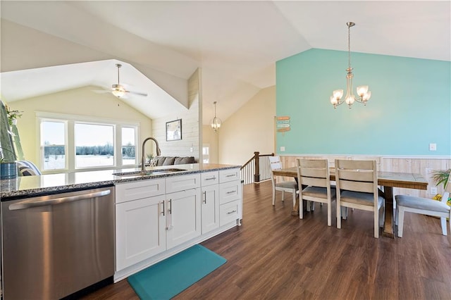 kitchen with white cabinetry, dishwasher, sink, stone countertops, and ceiling fan with notable chandelier