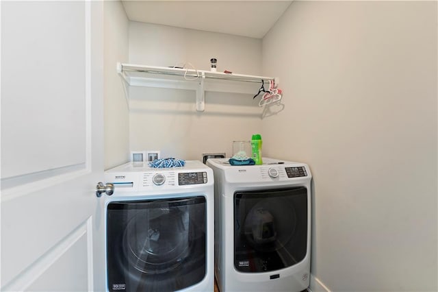 laundry room featuring washer and clothes dryer