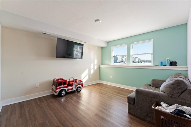 sitting room featuring dark hardwood / wood-style floors