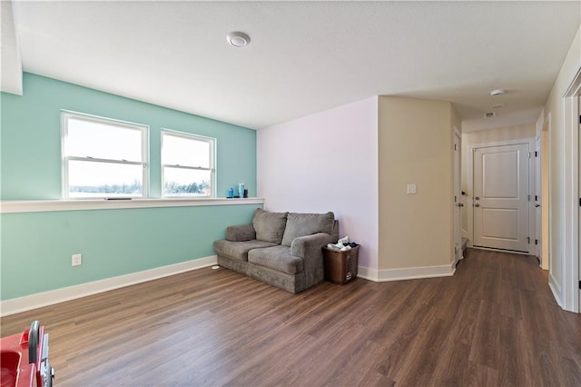 sitting room featuring dark hardwood / wood-style flooring