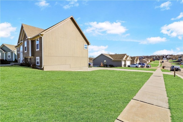 view of side of property featuring a lawn