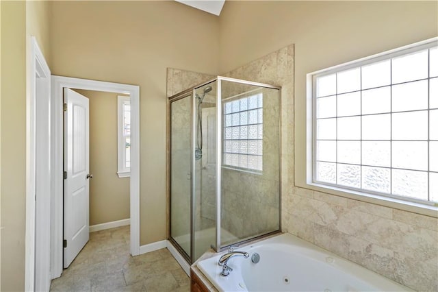 bathroom featuring separate shower and tub