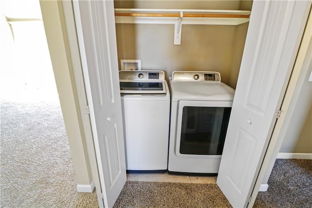 laundry room with light carpet and washer and clothes dryer