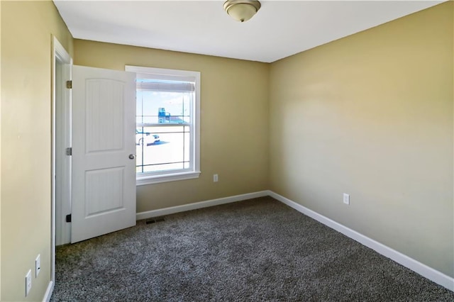 442 Redbud Ct, Warrensburg, MO 64093 - unfurnished room with dark carpet and baseboards