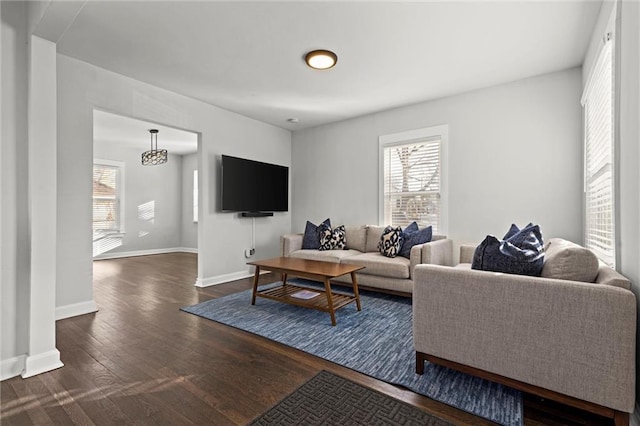 living room with dark wood-type flooring