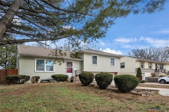 view of front of house with a front lawn and a garage