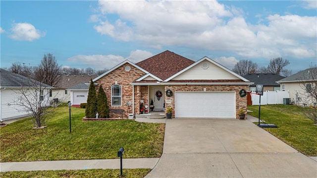 view of front of property with a front yard, central AC, and a garage