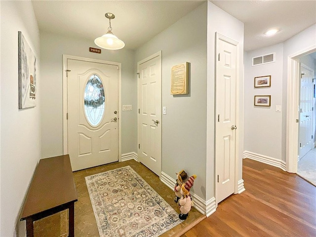 entrance foyer featuring dark wood-type flooring