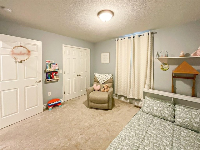 interior space with carpet flooring and a textured ceiling