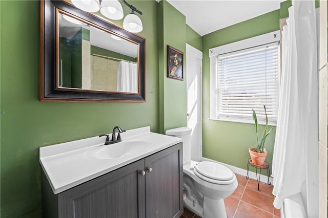 bathroom featuring vanity, tile patterned floors, and toilet