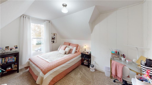 carpeted bedroom with vaulted ceiling