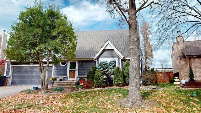 view of front facade featuring a front yard and a garage