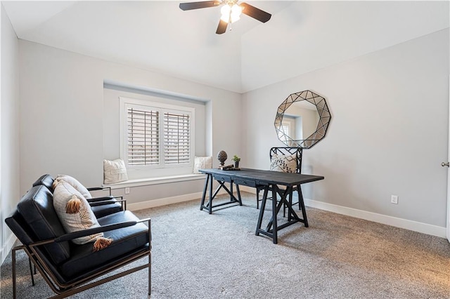 carpeted office with lofted ceiling and ceiling fan