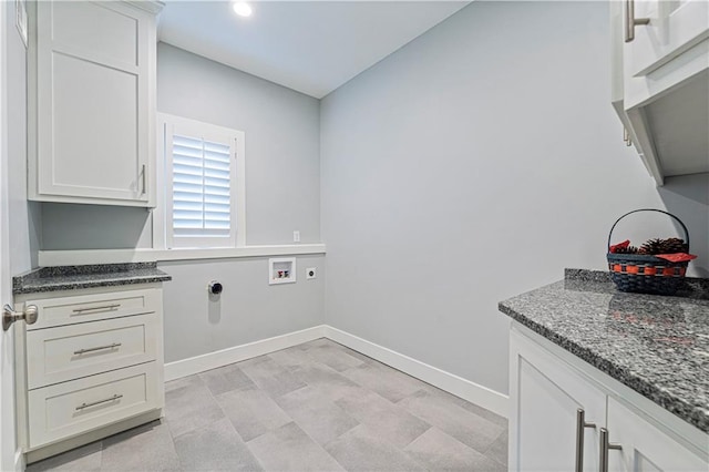 laundry room featuring cabinets, washer hookup, and electric dryer hookup