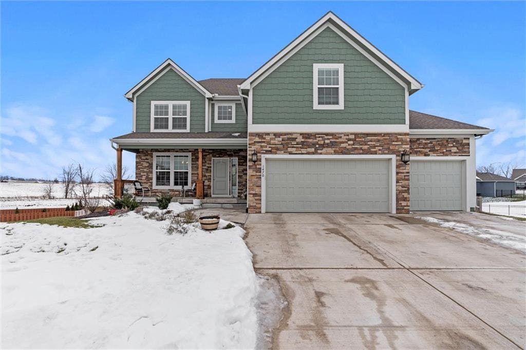 view of front of home with a garage and a porch