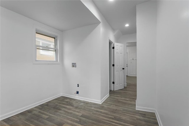 corridor with dark hardwood / wood-style floors